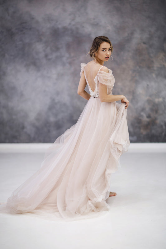 Blush tulle wedding dress with lace appliqué bodice