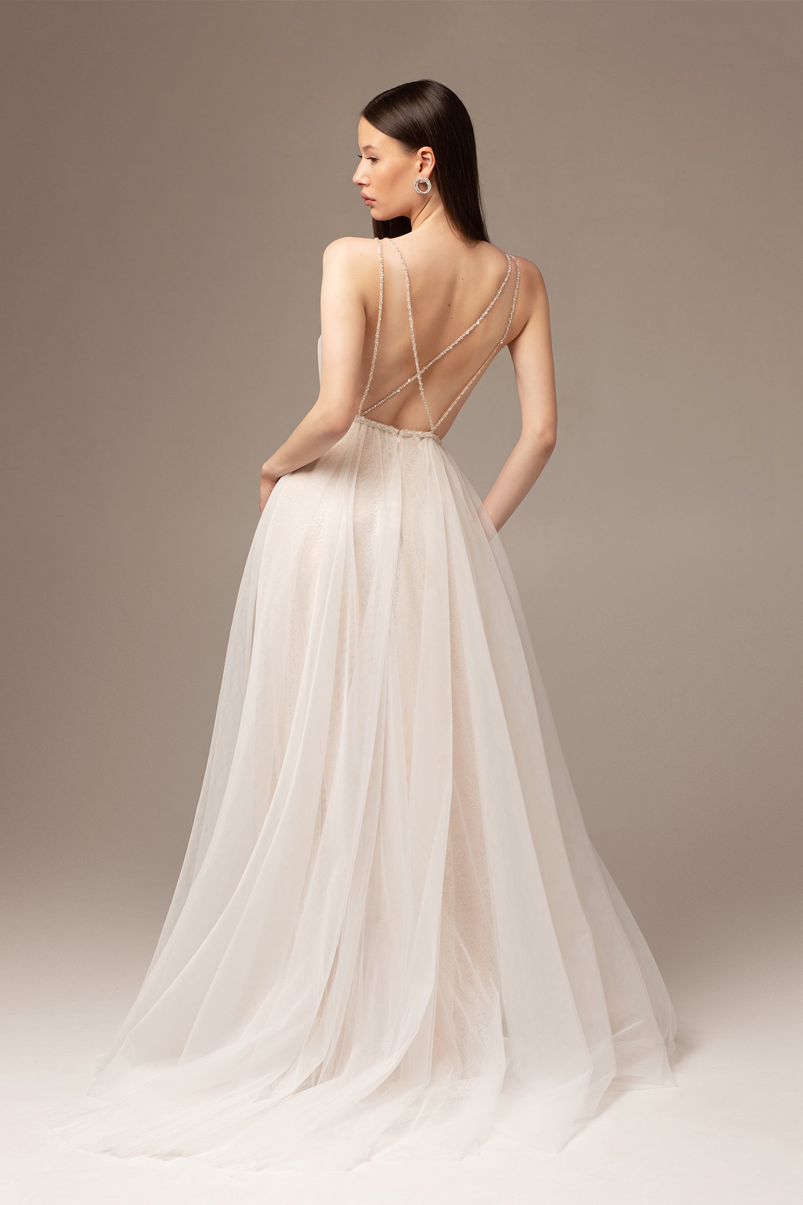 Backless draped tulle wedding dress with beaded belt