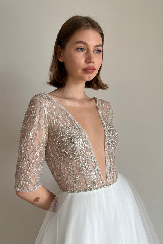 Sparkly wedding dress with deep V-neck