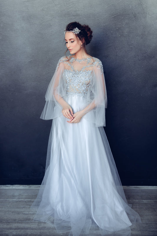 Ice blue wedding dress with beaded lace bodice and tulle sleeves