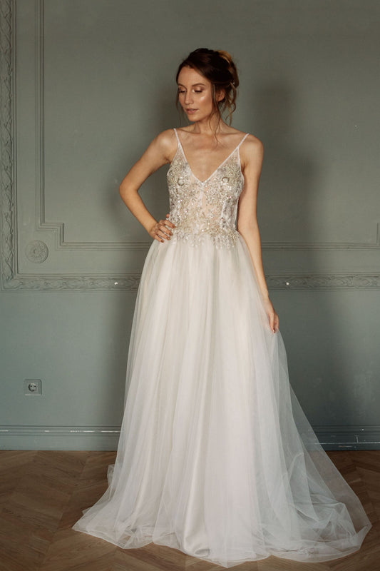 Lace top wedding dress with open back and tulle skirt