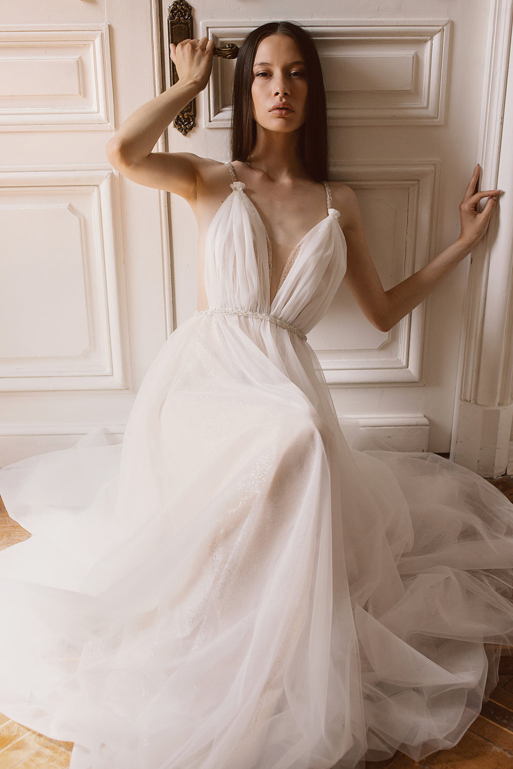 Backless draped tulle wedding dress with beaded belt
