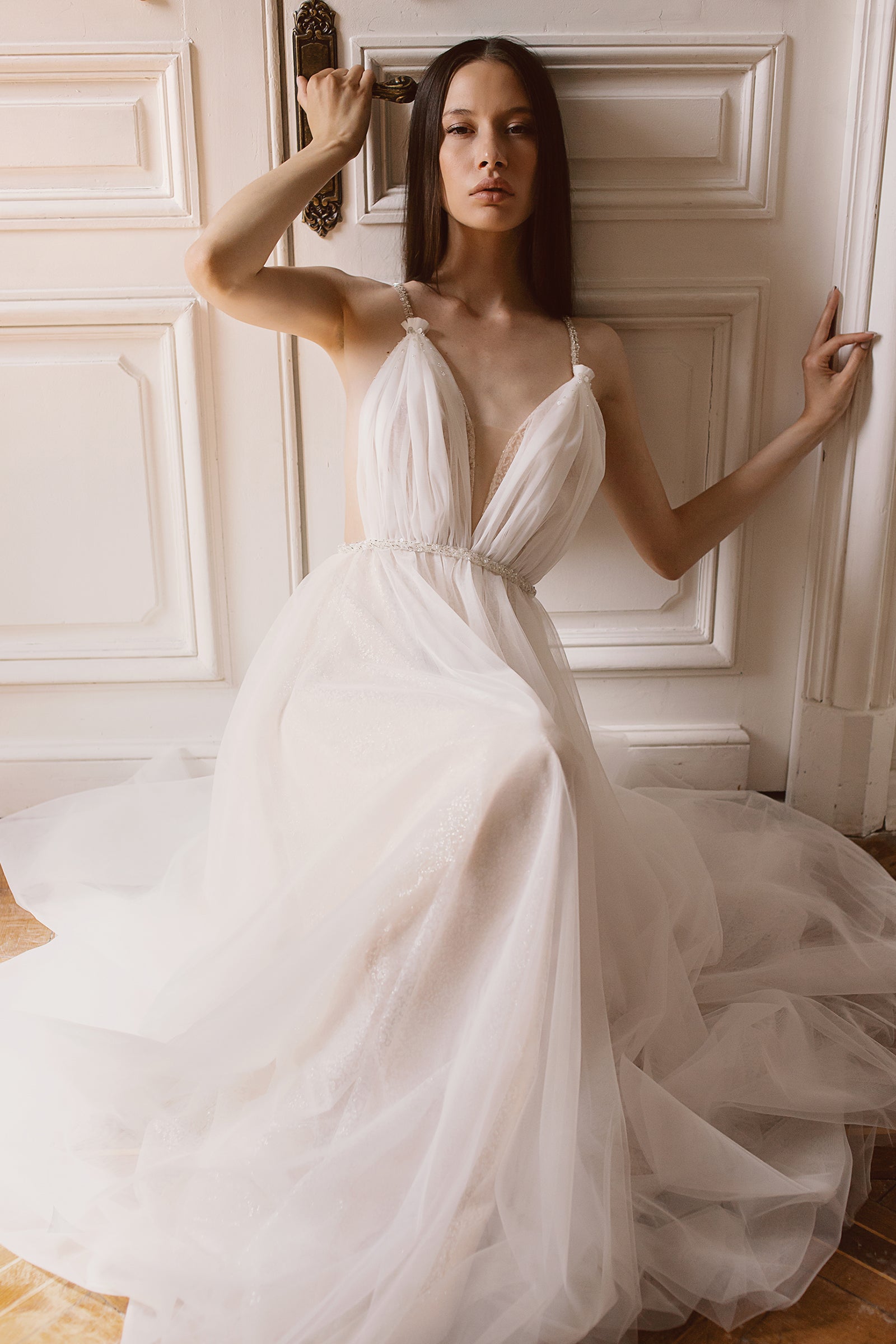 Backless draped tulle wedding dress with beaded belt
