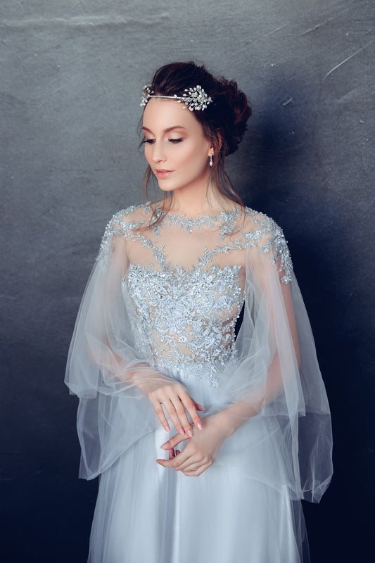 Ice blue wedding dress with beaded lace bodice and tulle sleeves
